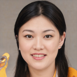 Joyful asian young-adult female with long  brown hair and brown eyes