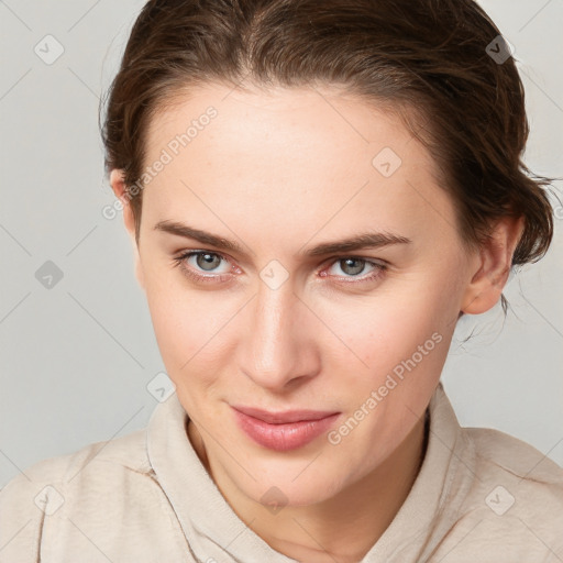 Joyful white young-adult female with medium  brown hair and blue eyes