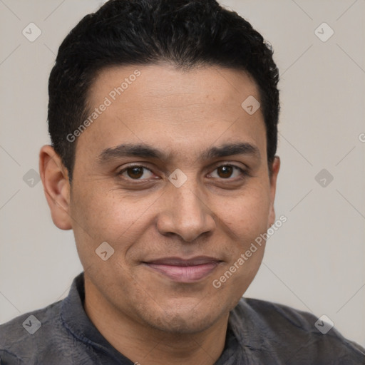 Joyful latino young-adult male with short  black hair and brown eyes