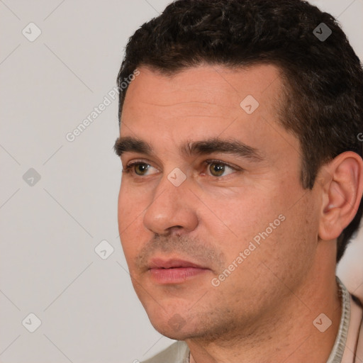 Joyful white young-adult male with short  black hair and brown eyes