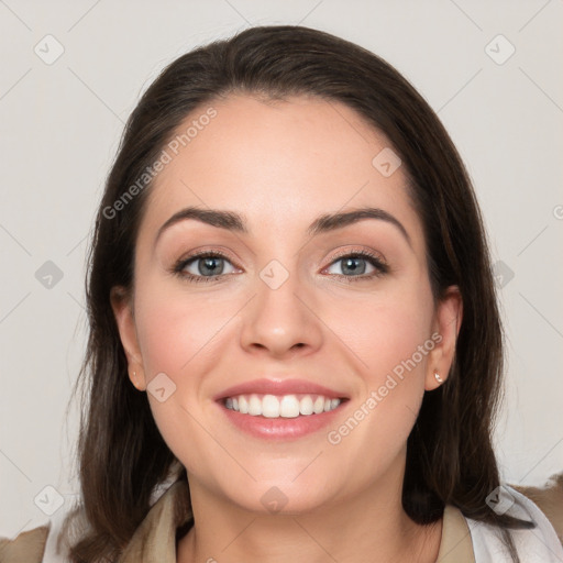 Joyful white young-adult female with medium  brown hair and grey eyes