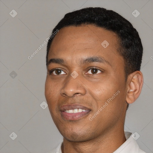 Joyful black young-adult male with short  black hair and brown eyes