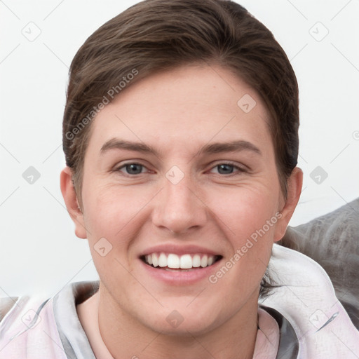 Joyful white young-adult female with short  brown hair and grey eyes