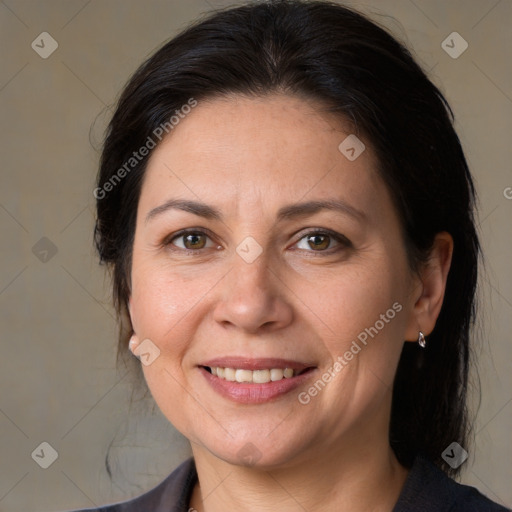 Joyful white adult female with medium  brown hair and brown eyes