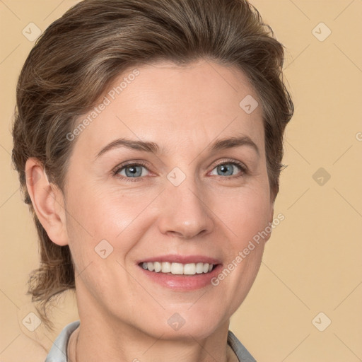 Joyful white adult female with short  brown hair and grey eyes