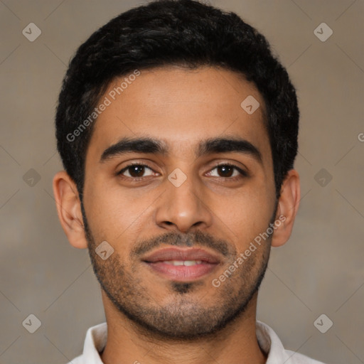 Joyful latino young-adult male with short  black hair and brown eyes