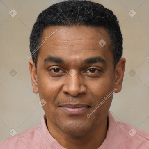 Joyful latino adult male with short  black hair and brown eyes