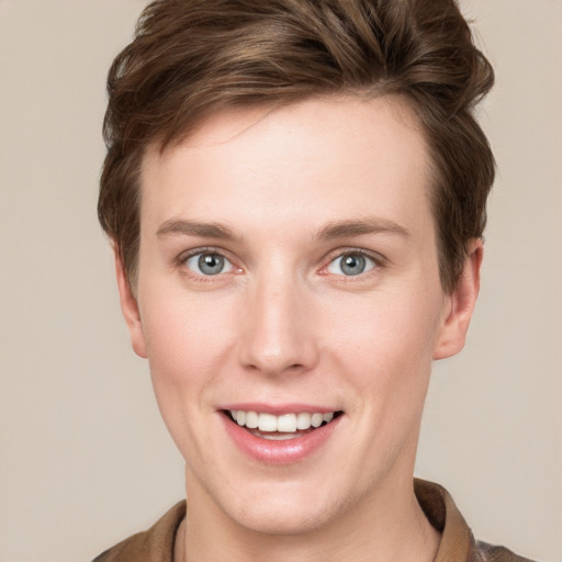 Joyful white young-adult female with short  brown hair and grey eyes