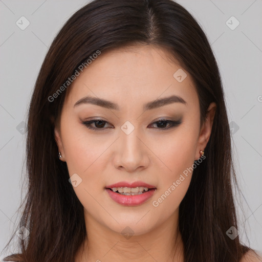 Joyful asian young-adult female with long  brown hair and brown eyes