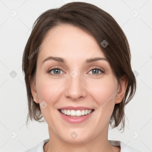 Joyful white young-adult female with medium  brown hair and green eyes