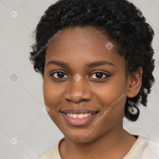 Joyful black young-adult female with medium  black hair and brown eyes