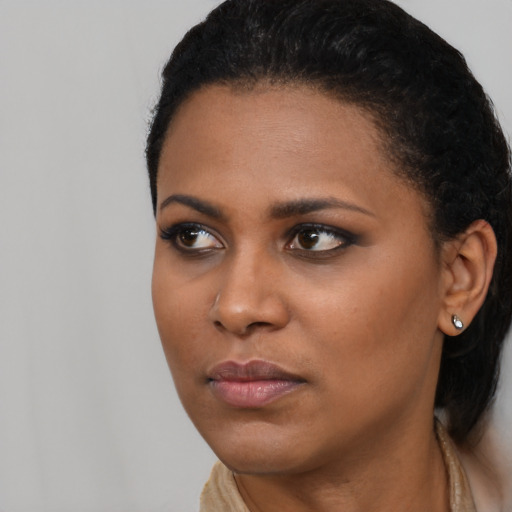 Neutral black young-adult female with long  black hair and brown eyes