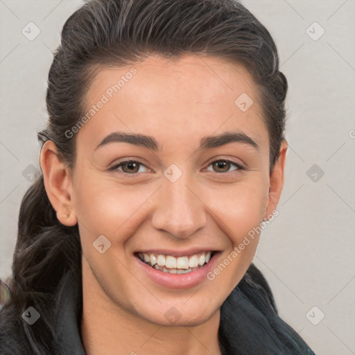 Joyful white young-adult female with long  brown hair and brown eyes