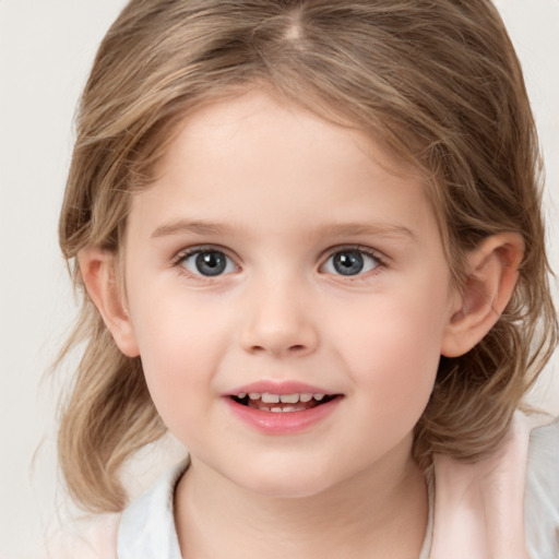 Joyful white child female with medium  brown hair and brown eyes