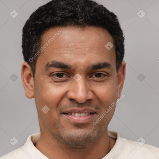 Joyful latino young-adult male with short  brown hair and brown eyes