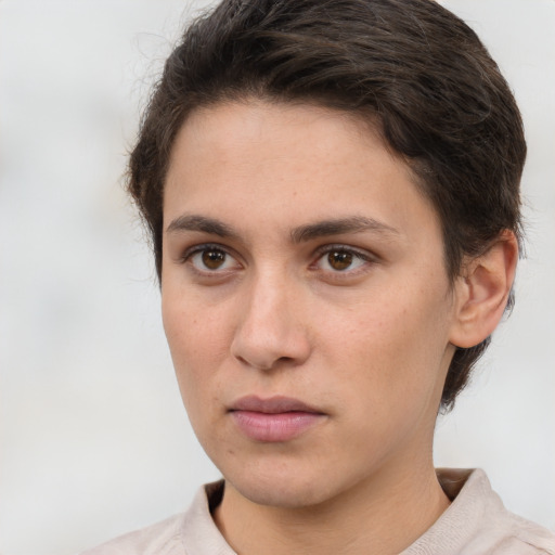 Neutral white young-adult female with short  brown hair and brown eyes