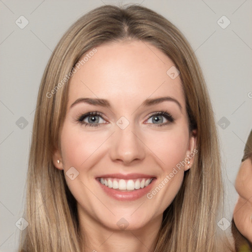 Joyful white young-adult female with long  brown hair and brown eyes