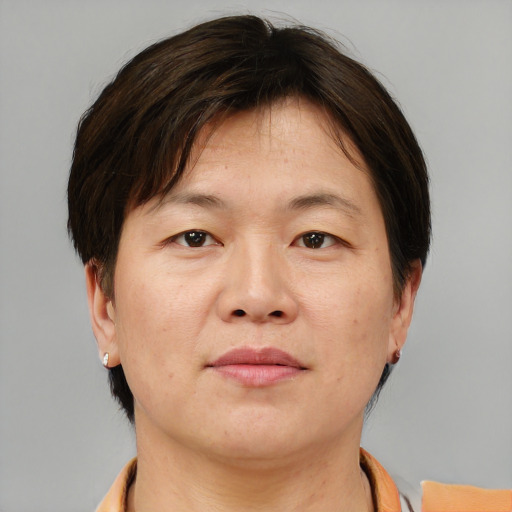 Neutral asian adult female with short  brown hair and brown eyes