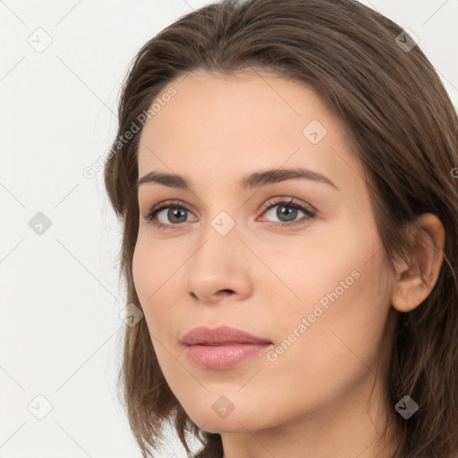 Neutral white young-adult female with long  brown hair and brown eyes