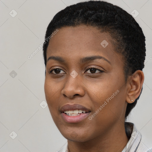 Joyful black young-adult female with short  black hair and brown eyes