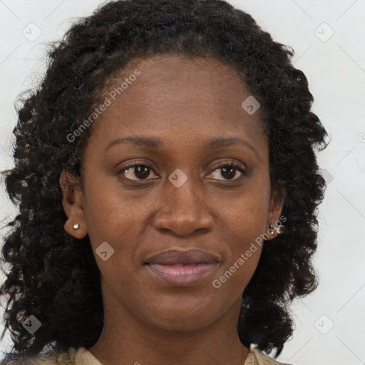 Joyful black young-adult female with long  brown hair and brown eyes