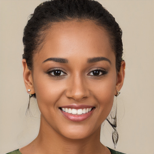 Joyful latino young-adult female with short  brown hair and brown eyes