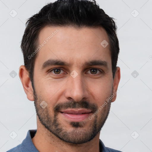 Joyful white young-adult male with short  black hair and brown eyes