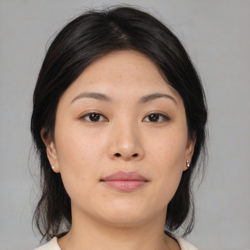 Neutral asian young-adult female with medium  brown hair and brown eyes