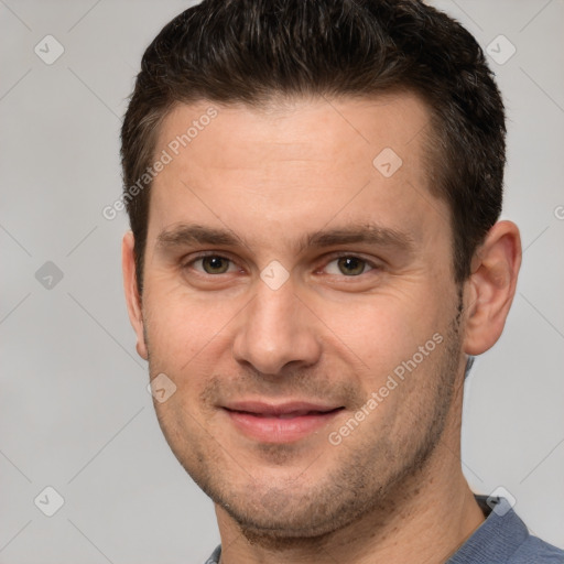 Joyful white young-adult male with short  brown hair and grey eyes