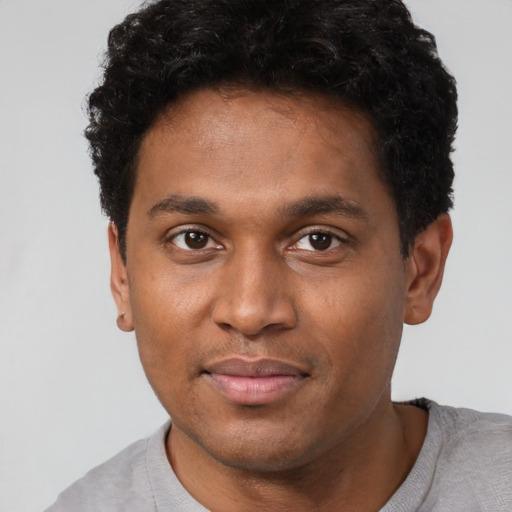 Neutral black young-adult male with short  brown hair and brown eyes