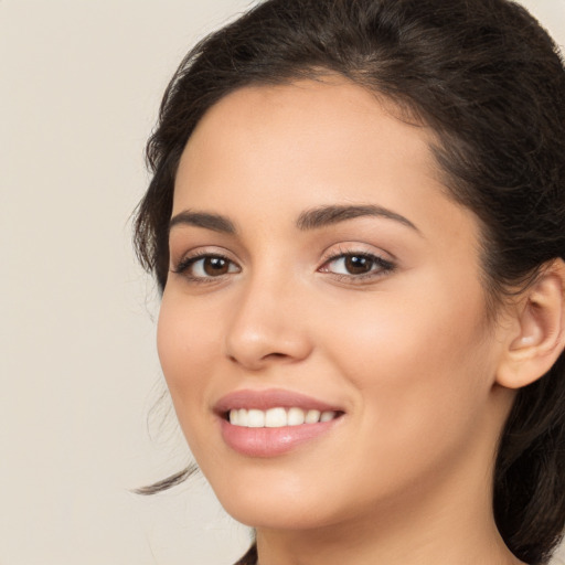 Joyful white young-adult female with medium  brown hair and brown eyes