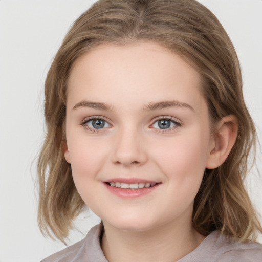 Joyful white child female with medium  brown hair and grey eyes