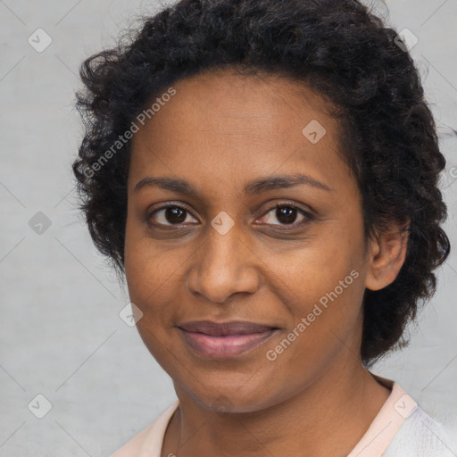 Joyful black young-adult female with medium  brown hair and brown eyes