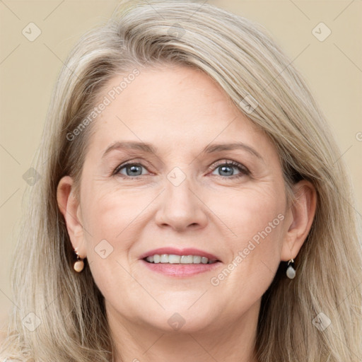 Joyful white adult female with long  brown hair and grey eyes