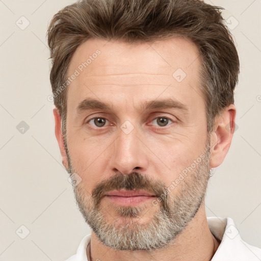 Neutral white adult male with short  brown hair and brown eyes