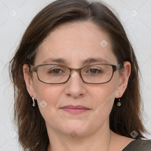 Joyful white adult female with medium  brown hair and grey eyes