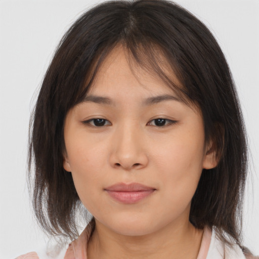 Neutral asian young-adult female with medium  brown hair and brown eyes