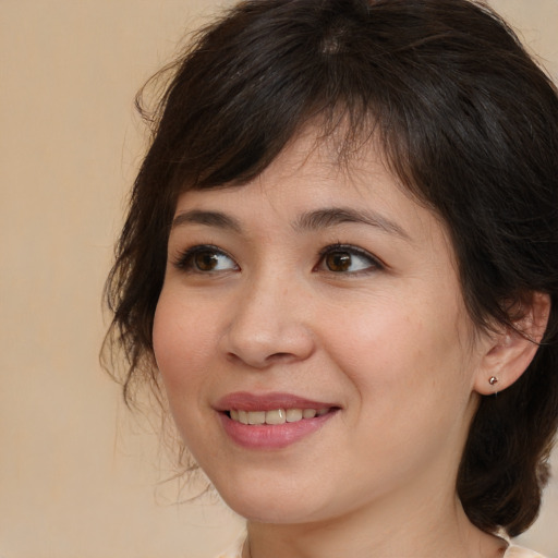 Joyful white young-adult female with medium  brown hair and brown eyes