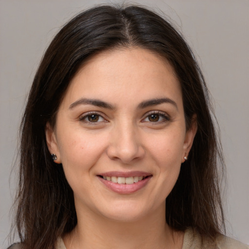 Joyful white young-adult female with medium  brown hair and brown eyes