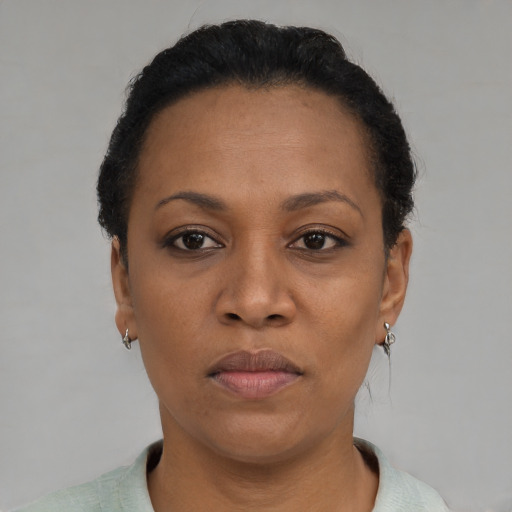 Neutral black adult female with short  brown hair and brown eyes