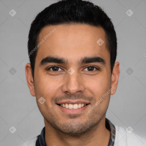 Joyful latino young-adult male with short  black hair and brown eyes