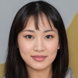 Joyful asian young-adult female with long  brown hair and brown eyes