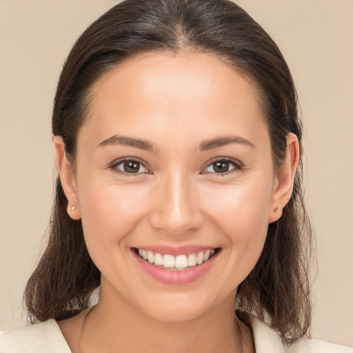 Joyful white young-adult female with medium  brown hair and brown eyes