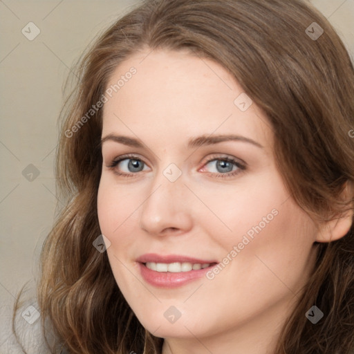 Joyful white young-adult female with long  brown hair and green eyes