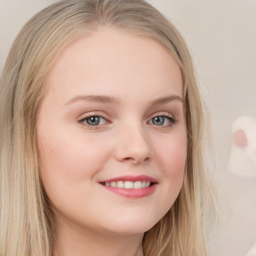 Joyful white child female with long  brown hair and brown eyes