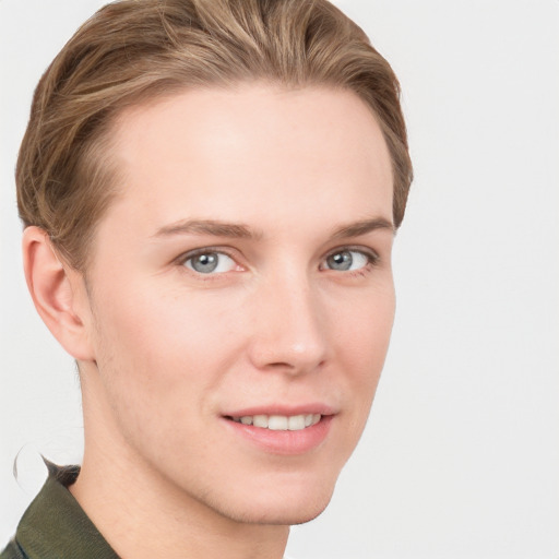 Joyful white young-adult female with short  brown hair and grey eyes