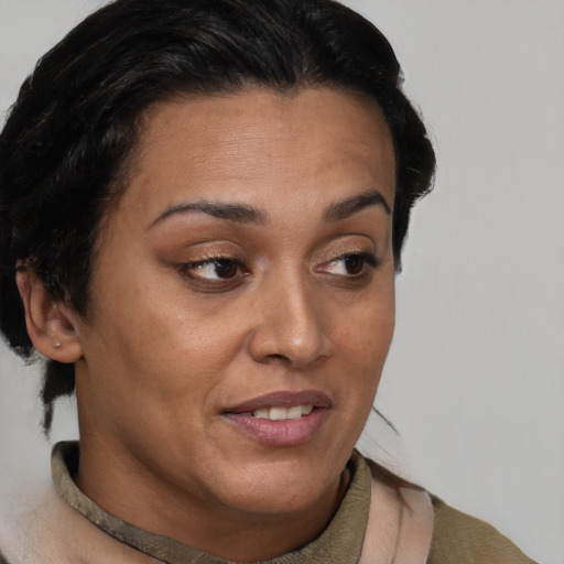 Joyful latino young-adult female with short  brown hair and brown eyes
