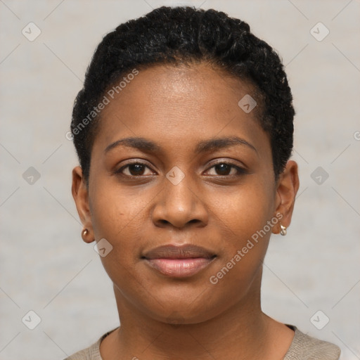 Joyful black young-adult female with short  black hair and brown eyes