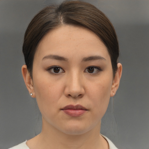 Neutral white young-adult female with short  brown hair and brown eyes