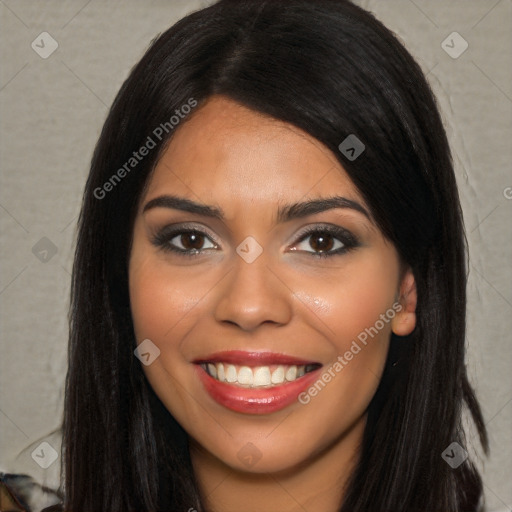 Joyful latino young-adult female with long  black hair and brown eyes